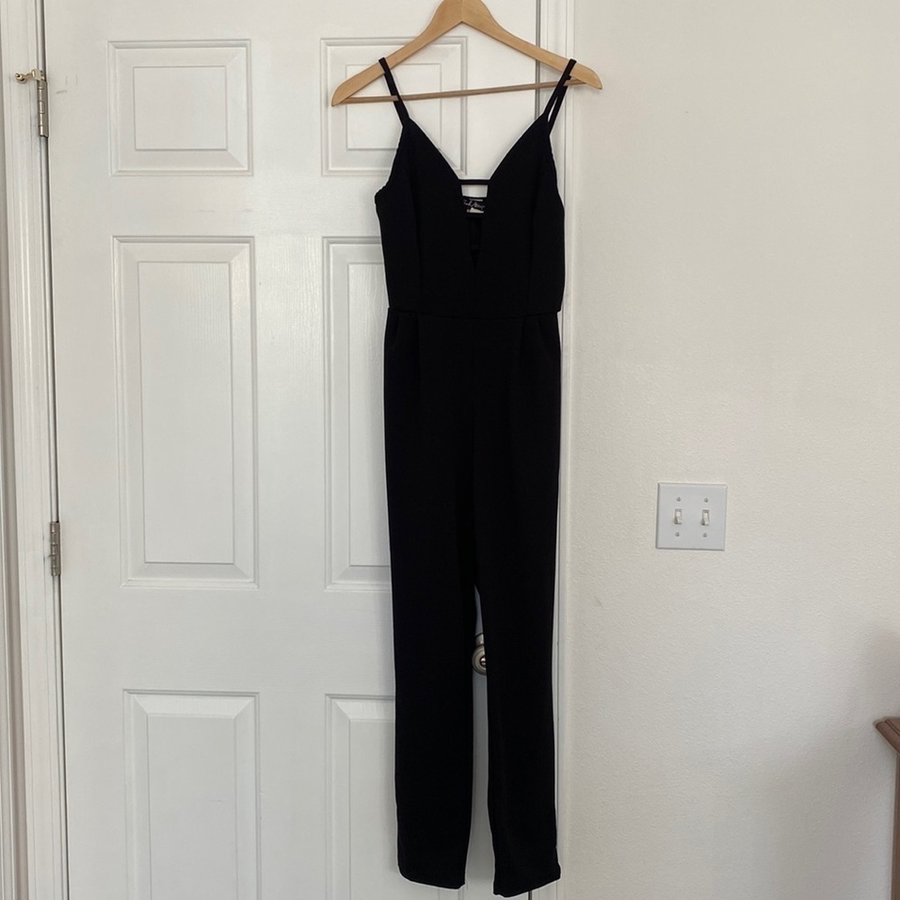 Y2K French Atmosphere black jumper with low cut neckline.